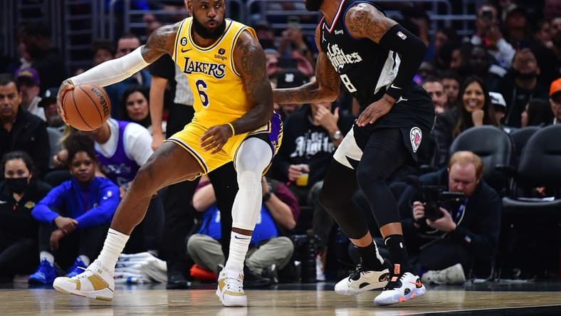Nov 9, 2022; Los Angeles, California, USA; Los Angeles Lakers forward LeBron James (6) moves the ball against Los Angeles Clippers forward Marcus Morris Sr. (8) during the second half at Crypto.com Arena. Mandatory Credit: Gary A. Vasquez-USA TODAY Sports