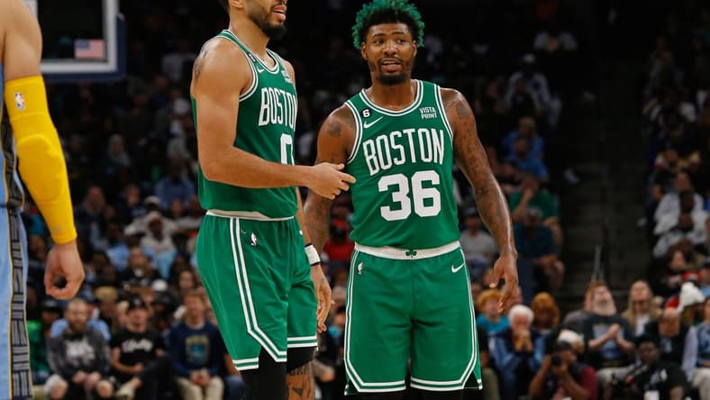 Nov 7, 2022; Memphis, Tennessee, USA; Boston Celtics forward Jayson Tatum (0) and Boston Celtics guard Marcus Smart (36) talk during the second half against the Memphis Grizzlies at FedExForum. Mandatory Credit: Petre Thomas-USA TODAY Sports