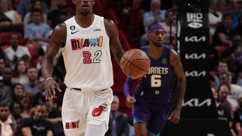Nov 10, 2022; Miami, Florida, USA; Miami Heat forward Jimmy Butler (22) dribbles the ball up the court against the Charlotte Hornets during the first half at FTX Arena. Mandatory Credit: Jasen Vinlove-USA TODAY Sports