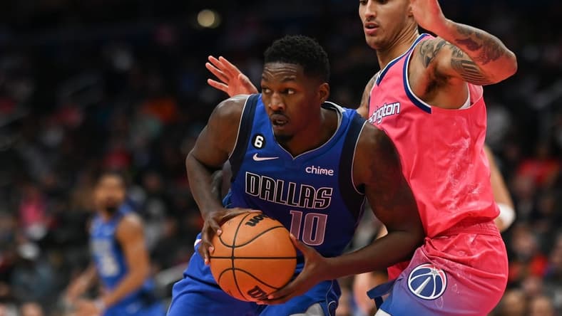 Nov 10, 2022; Washington, District of Columbia, USA; Dallas Mavericks forward Dorian Finney-Smith (10) looks to pass as Washington Wizards forward Kyle Kuzma (33) defends during the first half at Capital One Arena. Mandatory Credit: Tommy Gilligan-USA TODAY Sports