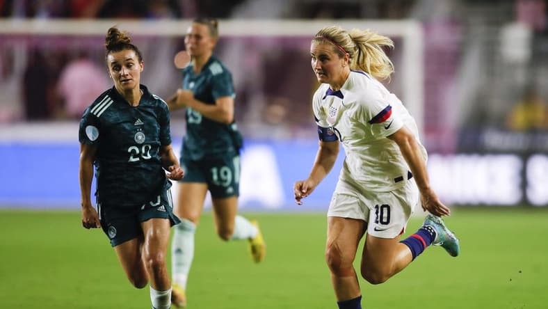Nov 10, 2022; Ft. Lauderdale, Florida, USA; United States midfielder Lindsey Horan (10) runs with the ball ahead of Germany midfielder Lina Magull (20) during the first half at DRV PNK Stadium. Mandatory Credit: Sam Navarro-USA TODAY Sports