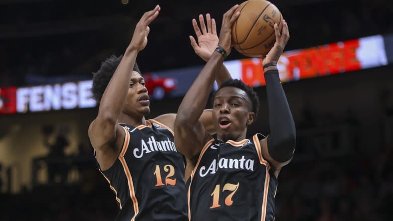 Nov 10, 2022; Atlanta, Georgia, USA; Atlanta Hawks forward Onyeka Okongwu (17) grabs a rebound against the  Philadelphia 76ers in the second quarter at State Farm Arena. Mandatory Credit: Brett Davis-USA TODAY Sports