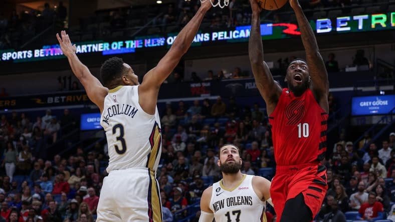 Nov 10, 2022; New Orleans, Louisiana, USA; Portland Trail Blazers forward Nassir Little (10) drives to the basket against New Orleans Pelicans guard CJ McCollum (3) during the first half at Smoothie King Center. Mandatory Credit: Stephen Lew-USA TODAY Sports
