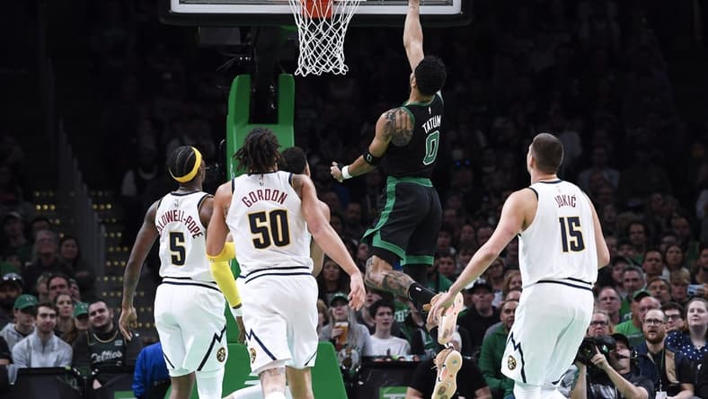 Nov 11, 2022; Boston, Massachusetts, USA; Boston Celtics forward Jayson Tatum (0) lays the ball in the basket during the first half against the Denver Nuggets at TD Garden. Mandatory Credit: Bob DeChiara-USA TODAY Sports