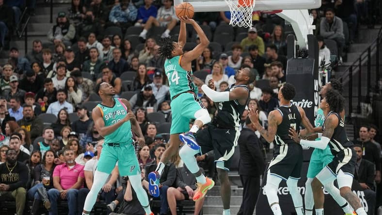 Nov 11, 2022; San Antonio, Texas, USA; San Antonio Spurs guard Devin Vassell (24) shoots over Milwaukee Bucks forward Serge Ibaka (25) in the first half at the AT&T Center. Mandatory Credit: Daniel Dunn-USA TODAY Sports
