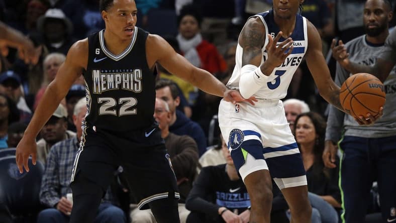 Nov 11, 2022; Memphis, Tennessee, USA; Minnesota Timberwolves forward Jaden McDaniels (3) looks for an open teammate as Memphis Grizzlies guard Desmond Bane (22) defends during the first half at FedExForum. Mandatory Credit: Petre Thomas-USA TODAY Sports