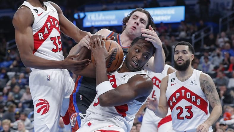 Nov 11, 2022; Oklahoma City, Oklahoma, USA; Oklahoma City Thunder guard Josh Giddey, back and Toronto Raptors forward O.G. Anunoby, front, fight for a loose ball during the second half at Paycom Center. Oklahoma City won 132-113. Mandatory Credit: Alonzo Adams-USA TODAY Sports