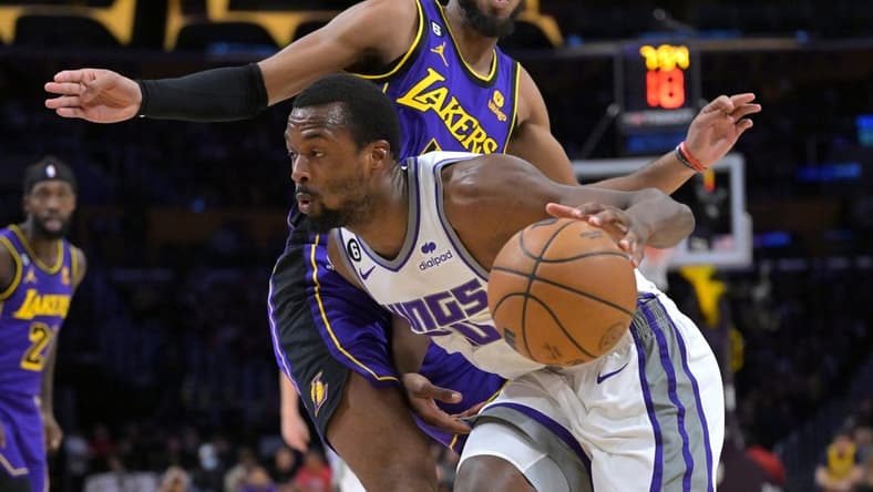 Nov 11, 2022; Los Angeles, California, USA; Los Angeles Lakers forward Troy Brown Jr. (7) guards Sacramento Kings forward Harrison Barnes (40) as he drives to the basket in the first half at Crypto.com Arena. Mandatory Credit: Jayne Kamin-Oncea-USA TODAY Sports