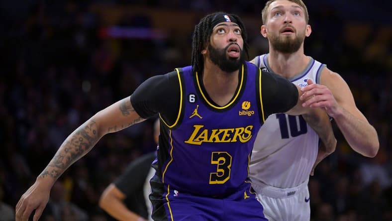Nov 11, 2022; Los Angeles, California, USA; Sacramento Kings forward Domantas Sabonis (10) guards Los Angeles Lakers forward Anthony Davis (3) wait for a rebound in the first half at Crypto.com Arena. Mandatory Credit: Jayne Kamin-Oncea-USA TODAY Sports