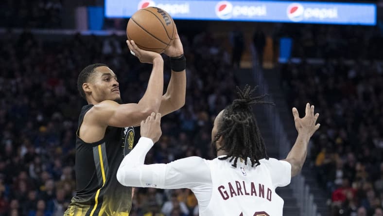 November 11, 2022; San Francisco, California, USA; Golden State Warriors guard Jordan Poole (3) shoots the basketball against Cleveland Cavaliers guard Darius Garland (10) during the third quarter at Chase Center. Mandatory Credit: Kyle Terada-USA TODAY Sports