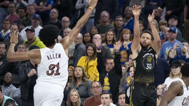 November 11, 2022; San Francisco, California, USA; Golden State Warriors guard Stephen Curry (30) shoots the basketball against Cleveland Cavaliers center Jarrett Allen (31) during the fourth quarter at Chase Center. Mandatory Credit: Kyle Terada-USA TODAY Sports