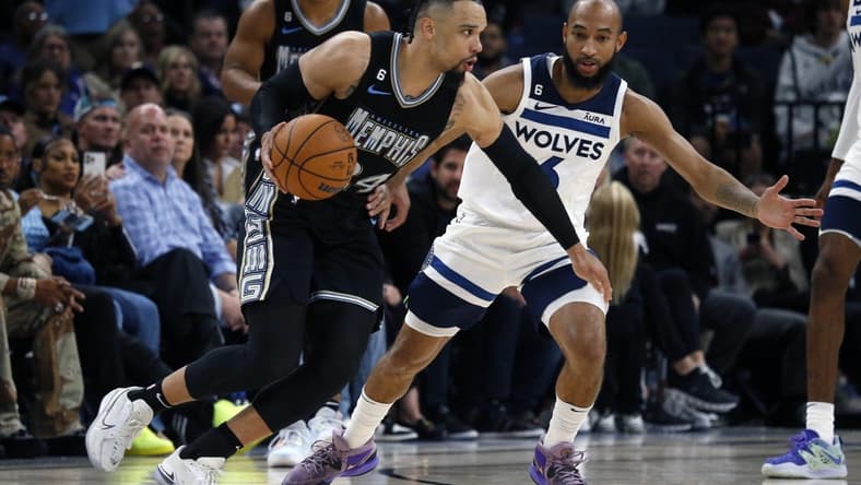 Nov 11, 2022; Memphis, Tennessee, USA; Memphis Grizzlies forward Dillon Brooks (24) dribbles as Minnesota Timberwolves guard Jordan McLaughlin (6) defends during the second half at FedExForum. Mandatory Credit: Petre Thomas-USA TODAY Sports