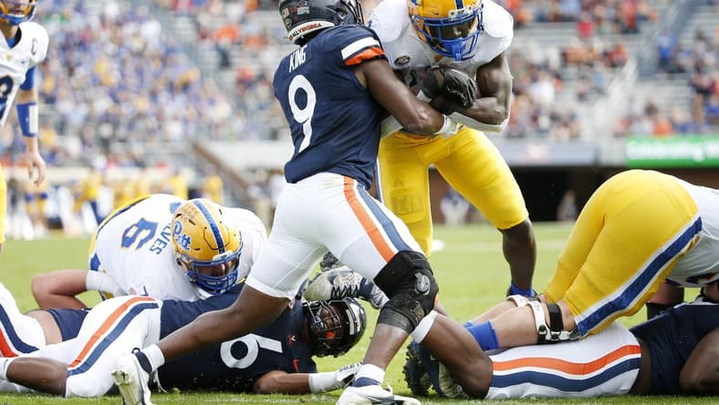 Nov 12, 2022; Charlottesville, Virginia, USA; Pittsburgh Panthers running back Israel Abanikanda (2) carries the ball to score a touchdown as Virginia Cavaliers defensive back Coen King (9) defends during the first half at Scott Stadium. Mandatory Credit: Amber Searls-USA TODAY Sports