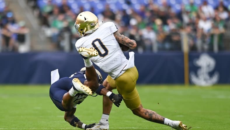 Nov 12, 2022; Baltimore, Maryland, USA; Notre Dame Fighting Irish wide receiver Braden Lenzy (0) toss a Navy Midshipmen defender during the first quarter at M&T Bank Stadium. Mandatory Credit: Tommy Gilligan-USA TODAY Sports