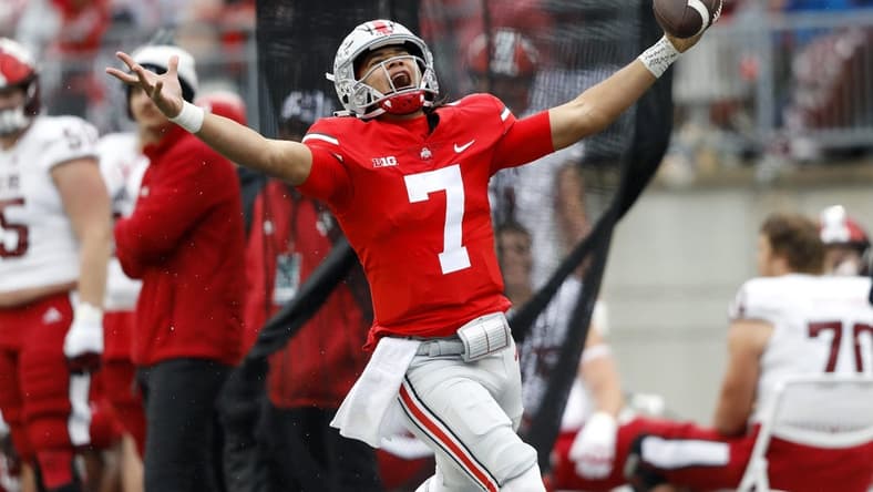 Nov 12, 2022; Columbus, Ohio, USA; Ohio State Buckeyes quarterback C.J. Stroud (7) runs for the first down during the third quarter against the Indiana Hoosiers at Ohio Stadium. Mandatory Credit: Joseph Maiorana-USA TODAY Sports