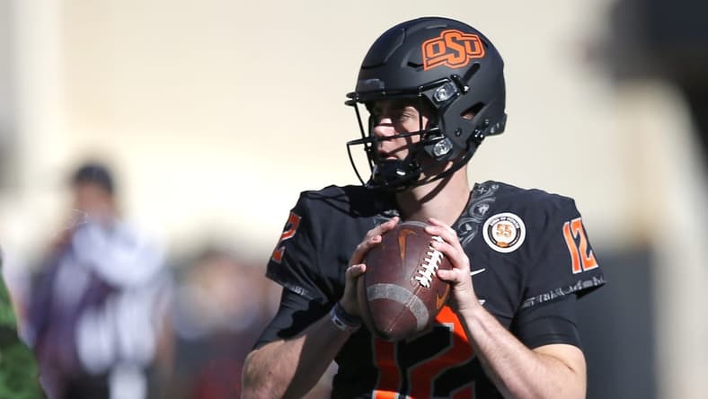 Nov 12, 2022; Stillwater, Oklahoma, USA; Oklahoma State's Gunnar Gundy (12) warms up before the college football game between the Oklahoma State Cowboys (OSU) and the Iowa State Cyclones at Boone Pickens Stadium. Mandatory Credit: Sarah Phipps/The Oklahoman-USA TODAY NETWORK