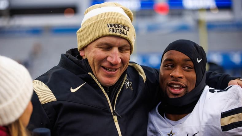 Nov 12, 2022; Lexington, Kentucky, USA; Vanderbilt Commodores running back Ray Davis (2) hugs head coach Clark Lea after the game against the Kentucky Wildcats at Kroger Field. Mandatory Credit: Jordan Prather-USA TODAY Sports