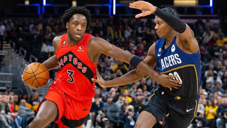 Nov 12, 2022; Indianapolis, Indiana, USA; Toronto Raptors forward O.G. Anunoby (3) dribbles the ball while Indiana Pacers guard Bennedict Mathurin (00) defends in the second quarter at Gainbridge Fieldhouse. Mandatory Credit: Trevor Ruszkowski-USA TODAY Sports