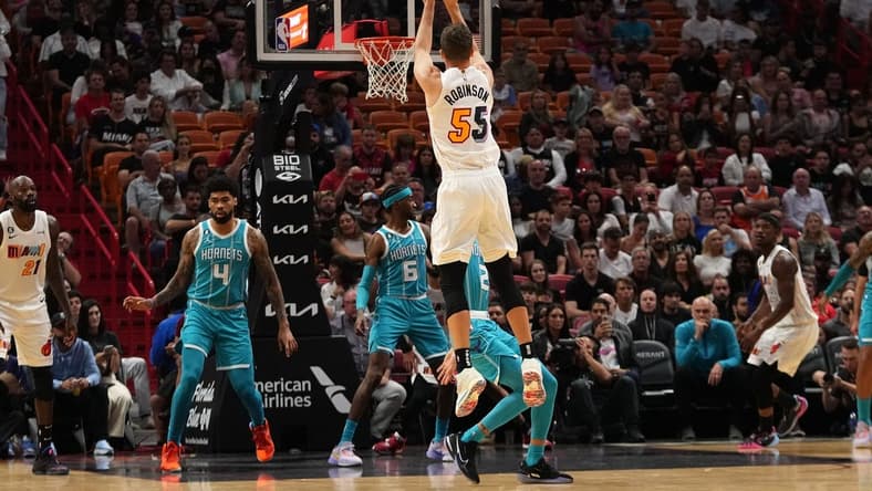 Nov 12, 2022; Miami, Florida, USA; Miami Heat guard Duncan Robinson (55) puts up a shot against the Charlotte Hornets during the first half at FTX Arena. Mandatory Credit: Jasen Vinlove-USA TODAY Sports