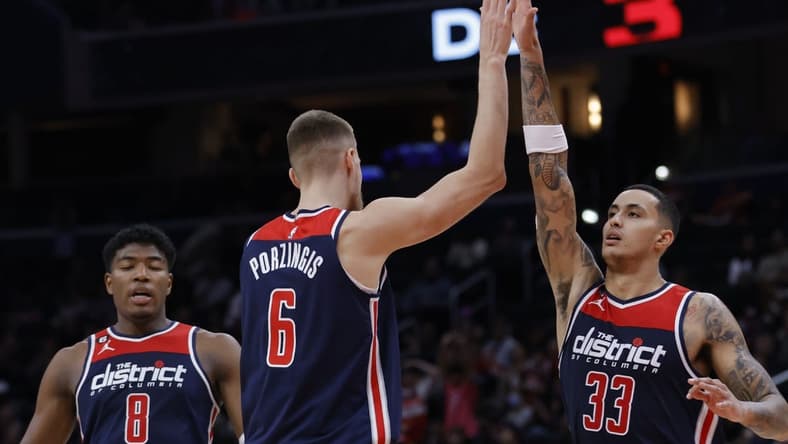 Nov 12, 2022; Washington, District of Columbia, USA; Washington Wizards center Kristaps Porzingis (6) celebrates with Wizards forward Kyle Kuzma (33) against the Utah Jazz in the fourth quarter at Capital One Arena. Mandatory Credit: Geoff Burke-USA TODAY Sports
