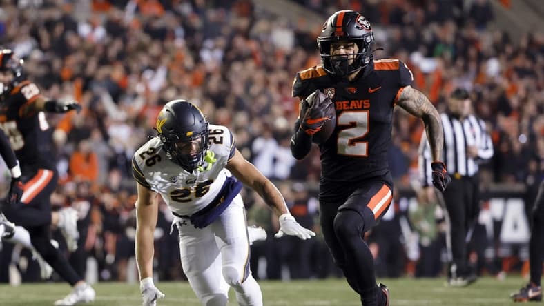 Nov 12, 2022; Corvallis, Oregon, USA; Oregon State Beavers wide receiver Anthony Gould (2) runs the ball for a touchdown during the first half against the California Golden Bears at Reser Stadium. Mandatory Credit: Soobum Im-USA TODAY Sports