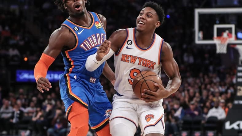 Nov 13, 2022; New York, New York, USA; New York Knicks guard RJ Barrett (9) collides with Oklahoma City Thunder forward Luguentz Dort (5) in the first half at Madison Square Garden. Mandatory Credit: Wendell Cruz-USA TODAY Sports
