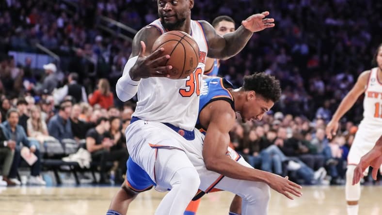 Nov 13, 2022; New York, New York, USA; New York Knicks forward Julius Randle (30) spins away from Oklahoma City Thunder guard Shai Gilgeous-Alexander (2) in the first half at Madison Square Garden. Mandatory Credit: Wendell Cruz-USA TODAY Sports