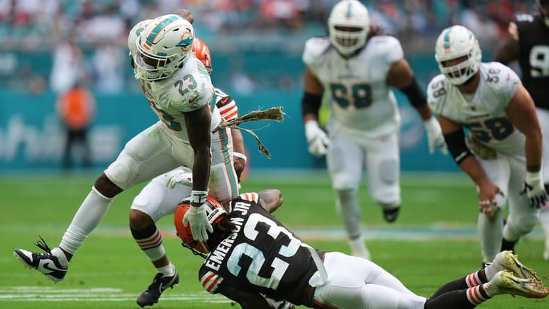 Nov 13, 2022; Miami Gardens, Florida, USA; Cleveland Browns cornerback Martin Emerson Jr. (23) attempts to tackle Miami Dolphins running back Jeff Wilson Jr. (23) during the first half at Hard Rock Stadium. Mandatory Credit: Jasen Vinlove-USA TODAY Sports