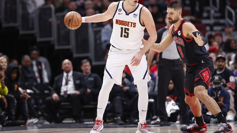 Nov 13, 2022; Chicago, Illinois, USA; Chicago Bulls center Nikola Vucevic (9) defends against Denver Nuggets center Nikola Jokic (15) during the first half at United Center. Mandatory Credit: Kamil Krzaczynski-USA TODAY Sports