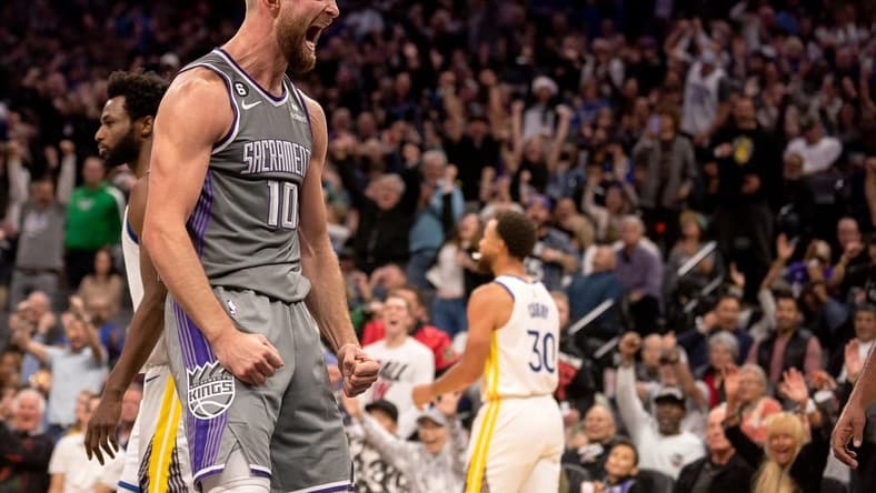 Nov 13, 2022; Sacramento, California, USA; Sacramento Kings forward Domantas Sabonis (10) celebrates after scoring during the fourth quarter against the Golden State Warriors at Golden 1 Center. Mandatory Credit: Ed Szczepanski-USA TODAY Sports