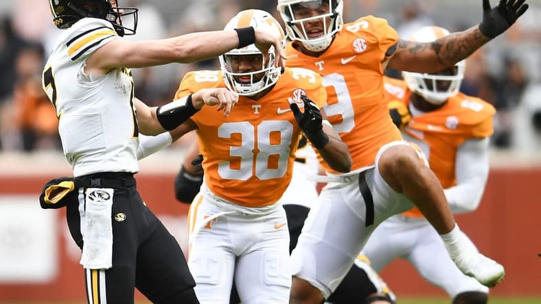 Tennessee linebacker Solon Page III (38) and defensive lineman/linebacker Tyler Baron (9) pressure Missouri quarterback Brady Cook (12) during an NCAA college football game on Saturday, November 12, 2022 in Knoxville, Tenn.
Ut Vs Missouri
