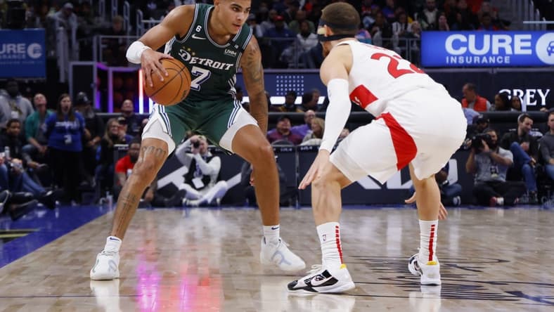 Nov 14, 2022; Detroit, Michigan, USA;  Detroit Pistons guard Killian Hayes (7) dribbles defended by Toronto Raptors guard Malachi Flynn (22) in the second half at Little Caesars Arena. Mandatory Credit: Rick Osentoski-USA TODAY Sports