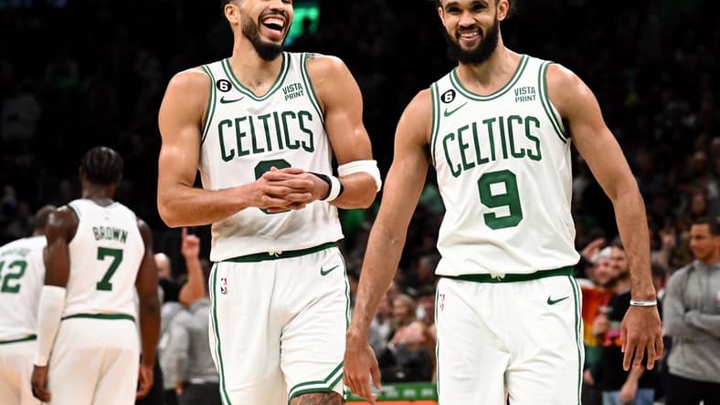 Nov 14, 2022; Boston, Massachusetts, USA; Boston Celtics forward Jayson Tatum (0) and guard Derrick White (9) react after defeating the Oklahoma City Thunder at the TD Garden. Mandatory Credit: Brian Fluharty-USA TODAY Sports