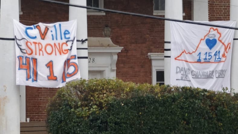 Nov 15, 2022; Charlottesville, Virginia, US; A memorial sign is displayed on a Greek house near the site where three Virginia Cavaliers football players were killed in a shooting on the grounds of the University of Virginia in Charlottesville. Mandatory Credit: Geoff Burke-USA TODAY NETWORK