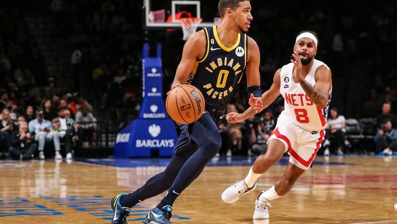 Oct 29, 2022; Brooklyn, New York, USA; Indiana Pacers guard Tyrese Haliburton (0) and Brooklyn Nets guard Patty Mills (8) at Barclays Center. Mandatory Credit: Wendell Cruz-USA TODAY Sports