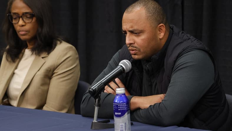 Nov 15, 2022; Charlottesville, Virginia, US; Virginia Cavaliers head coach Tony Elliott (R) answers a question from the media as Cavaliers athletic director Carla Williams (L) listens during a press conference regarding the deaths of three Cavaliers players from a shooting on the university grounds late Sunday night in Charlottesville. Mandatory Credit: Geoff Burke-USA TODAY NETWORK