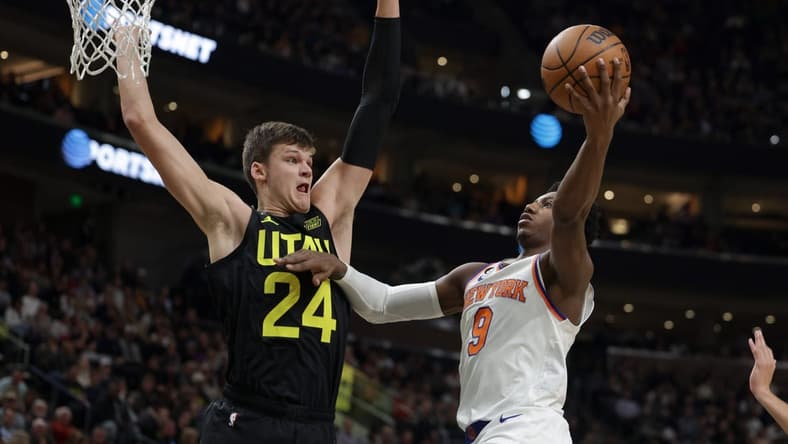 Nov 15, 2022; Salt Lake City, Utah, USA; Utah Jazz center Walker Kessler (24) tries to block the shot of New York Knicks guard RJ Barrett (9) during the second quarter at Vivint Arena. Mandatory Credit: Chris Nicoll-USA TODAY Sports