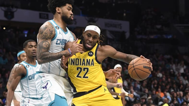 Nov 16, 2022; Charlotte, North Carolina, USA; Indiana Pacers forward Isaiah Jackson (22) drives on Charlotte Hornets center Nick Richards (4) during the first half at the Spectrum Center. Mandatory Credit: Sam Sharpe-USA TODAY Sports