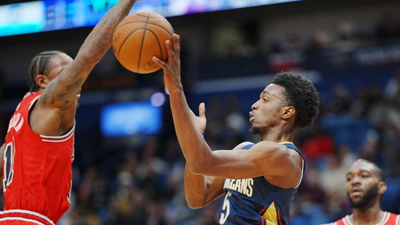 Nov 16, 2022; New Orleans, Louisiana, USA; New Orleans Pelicans forward Herbert Jones (5) attempts to pass the ball against Chicago Bulls forward DeMar DeRozan (11) during the first quarter at Smoothie King Center. Mandatory Credit: Andrew Wevers-USA TODAY Sports