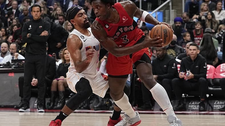 Nov 16, 2022; Toronto, Ontario, CAN; Miami Heat guard Gabe Vincent (2) defends against Toronto Raptors forward O.G. Anunoby (3) during the first half at Scotiabank Arena. Mandatory Credit: John E. Sokolowski-USA TODAY Sports