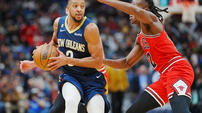 Nov 16, 2022; New Orleans, Louisiana, USA; New Orleans Pelicans guard CJ McCollum (3) fights for position against Chicago Bulls guard Ayo Dosunmu (12) during the second quarter at Smoothie King Center. Mandatory Credit: Andrew Wevers-USA TODAY Sports