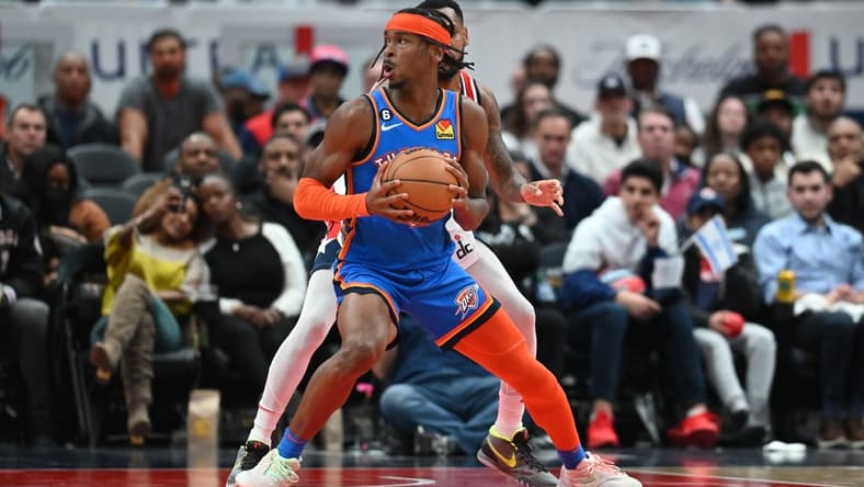 Nov 16, 2022; Washington, District of Columbia, USA; Oklahoma City Thunder guard Shai Gilgeous-Alexander (2) looks to shoot on Washington Wizards forward Kyle Kuzma (33) during the fourth quarter at Capital One Arena. Mandatory Credit: Tommy Gilligan-USA TODAY Sports