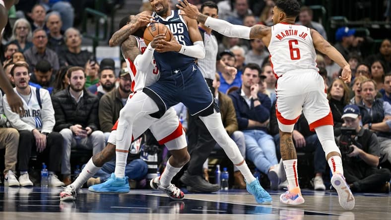 Nov 16, 2022; Dallas, Texas, USA; Houston Rockets guard Kevin Porter Jr. (3) and forward Kenyon Martin Jr. (6) defend against Dallas Mavericks center Christian Wood (35) during the second quarter at the American Airlines Center. Mandatory Credit: Jerome Miron-USA TODAY Sports