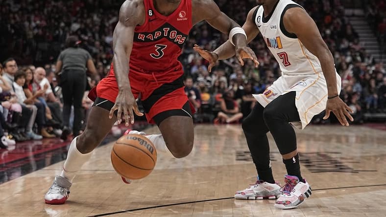 Nov 16, 2022; Toronto, Ontario, CAN; Toronto Raptors forward O.G. Anunoby (3) drives to the net past Miami Heat guard Kyle Lowry (7) during the second half at Scotiabank Arena. Mandatory Credit: John E. Sokolowski-USA TODAY Sports