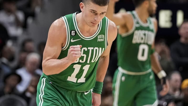 Nov 16, 2022; Atlanta, Georgia, USA; Boston Celtics guard Payton Pritchard (11) reacts after making a three point basket against the Atlanta Hawks during the second half at State Farm Arena. Mandatory Credit: Dale Zanine-USA TODAY Sports