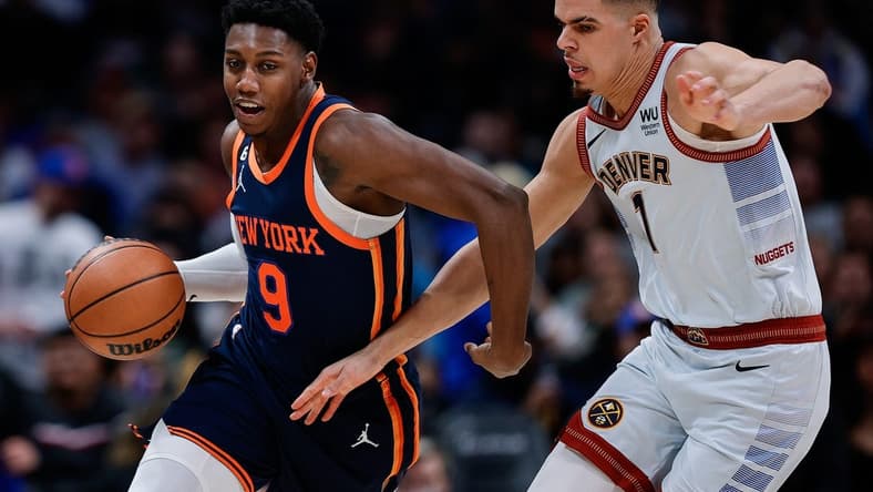 Nov 16, 2022; Denver, Colorado, USA; New York Knicks guard RJ Barrett (9) controls the ball against Denver Nuggets forward Michael Porter Jr. (1) in the third quarter at Ball Arena. Mandatory Credit: Isaiah J. Downing-USA TODAY Sports