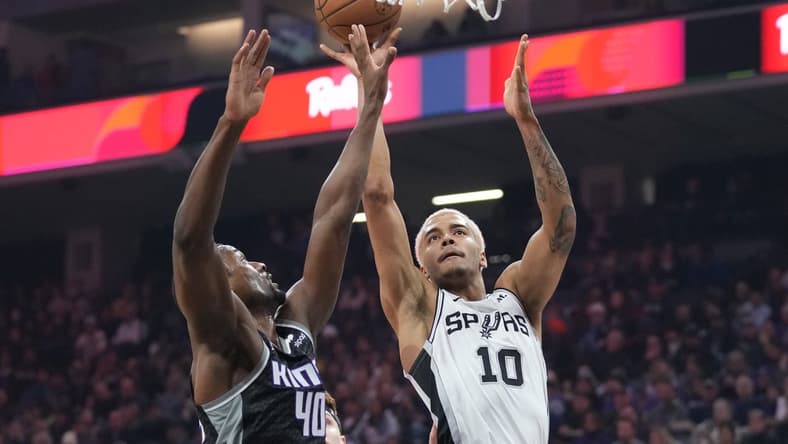 November 17, 2022; Sacramento, California, USA;  San Antonio Spurs forward Jeremy Sochan (10) shoots the basketball against Sacramento Kings forward Harrison Barnes (40) during the first quarter at Golden 1 Center. Mandatory Credit: Kyle Terada-USA TODAY Sports