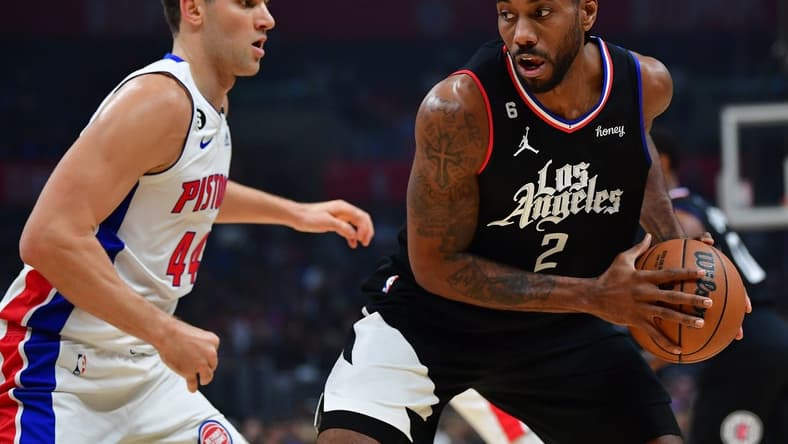 Nov 17, 2022; Los Angeles, California, USA; Los Angeles Clippers forward Kawhi Leonard (2) controls the ball against Detroit Pistons forward Bojan Bogdanovic (44) during the first half at Crypto.com Arena. Mandatory Credit: Gary A. Vasquez-USA TODAY Sports