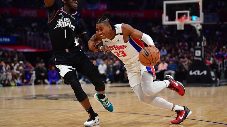 Nov 17, 2022; Los Angeles, California, USA; Detroit Pistons guard Jaden Ivey (23) moves to the basket against Los Angeles Clippers guard Reggie Jackson (1) during the second half at Crypto.com Arena. Mandatory Credit: Gary A. Vasquez-USA TODAY Sports