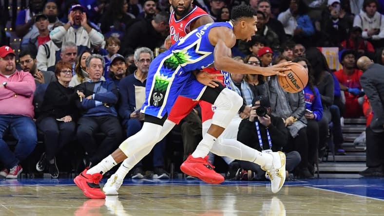 Nov 18, 2022; Philadelphia, Pennsylvania, USA; Milwaukee Bucks forward Giannis Antetokounmpo (34) drives to the basket past Philadelphia 76ers center Joel Embiid (21) during the first quarter at Wells Fargo Center. Mandatory Credit: Eric Hartline-USA TODAY Sports